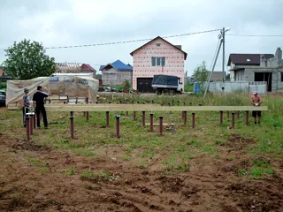 House built to a custom design, Brekhovo village: foundation and sill strapping