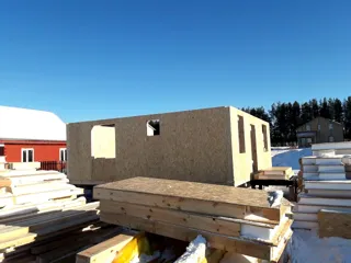 House based on the “Yessentuki 7.5x7.5” design, Kamenki village: wall assembly