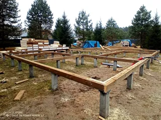 House built to a custom design, Svetloe village: foundation and sill strapping
