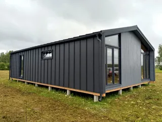 Haus nach Projekt „BarnHouse 76“, Gebiet Iwanowo: Fassadenverkleidung