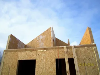 House based on the “Avdeevo” design, Molodtsovo settlement: wall assembly