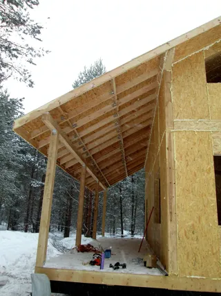 Custom-design house, Malye Soli village: terrace and porch