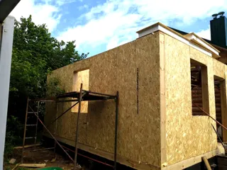 Custom-design extension, Uvod village: wall assembly